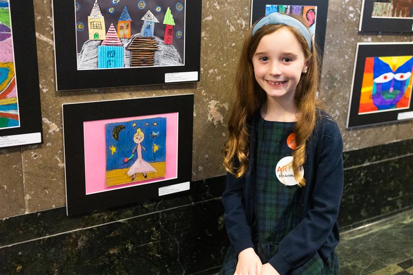 Students and their family at an art show
